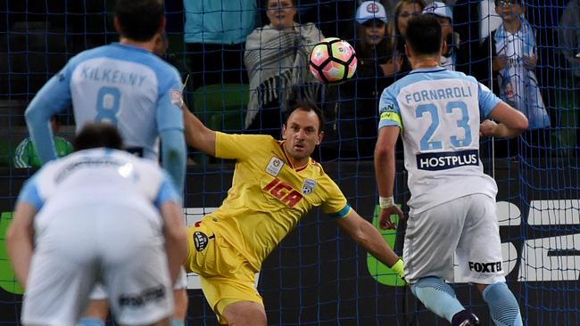 Eugene Galekovic defends in front of Bruno Fornaroli at AAMI Park in Melbourne (AAP Image/Tracey Nearmy)