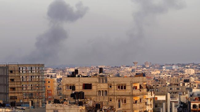 Smoke billows from buildings following an Israeli air strike in Rafah.