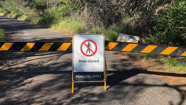 Keep out signs and barriers seen at the entrance to Blue Fish Point, North Head. Picture: Jim O'Rourke