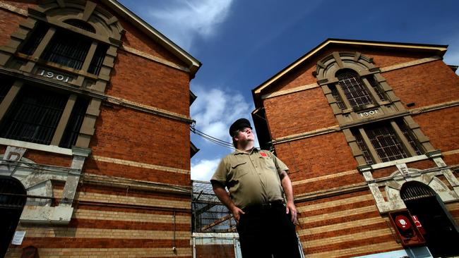 Jack Sim adn the Victorian-era cell blocks which will be lost to Queensland’s social history. Picture: Chris McCormack.