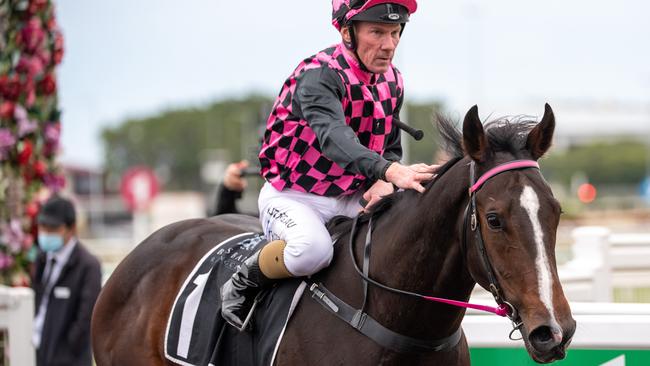 Jockey Jim Byrne returns to scale after riding Rothfire to victory in the Moet &amp; Chandon Champagne Classic. Picture: AAP/Supplied by Michael McInally, Racing Queensland