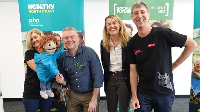 From left: Play therapist Lisa Wilson, Jack the Flood Puppet, Senator Murray Watt, Healthy North Coast CEO Monica Wheeler, and Social Futures CEO Tony Davies.