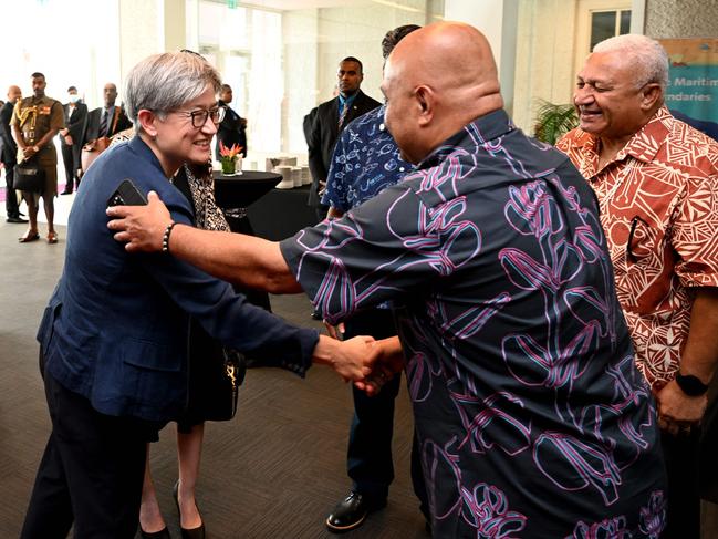 Australia's foreign minister, Penny Wong (L), greets David Panuelo, President of Federated States of Micronesia (C) while Fiji Prime Minster Frank Bainimarama (R) looks on in Suva. Picture: William West / AFP