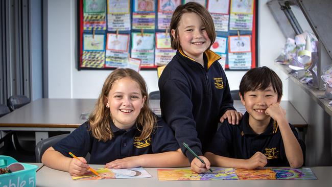 Dernancourt Primary School year 3s Indy, Ethan and Hiro. SA’s Year 3s had their best result in reading, writing, and spelling. Picture: Emma Brasier