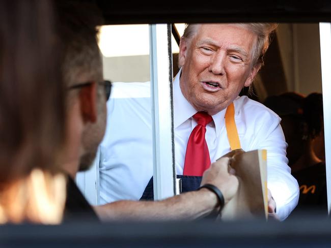 Donald Trump serving fries at a McDonald’s drive-through.