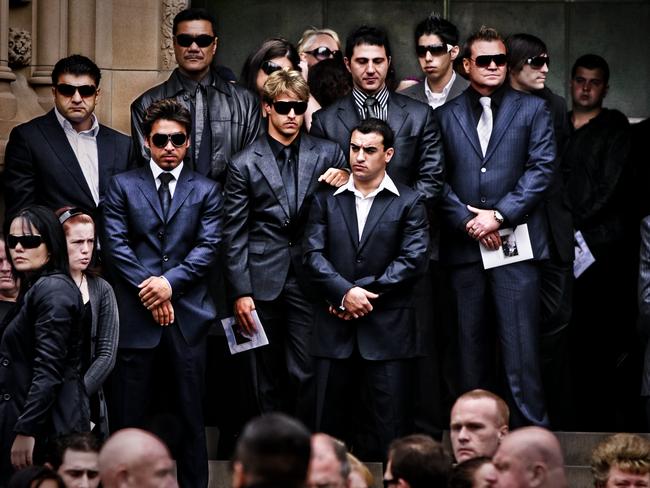 John Ibrahim (standing, second from left) attends the funeral service of Todd O'Connor with friends and associates in 2009. Picture: Craig Greenhill