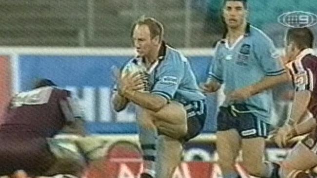 Video still of Adam MacDougall (ball) lifting his knee during game 2 of 2001.