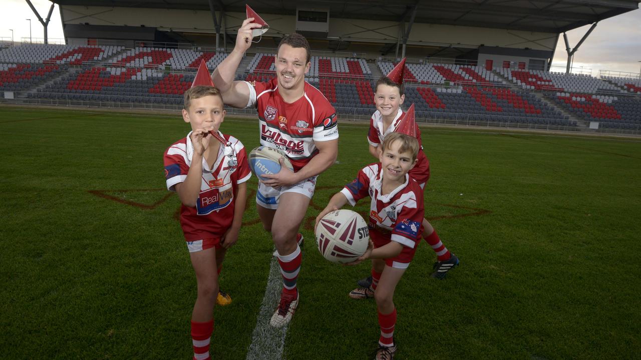 Amare Wynyard, left, and Cody Starr, back right as children in 2016 with former Dolphins captain Sam Anderson and another junior, Fin Scarborough. Picture: Bradley Cooper.