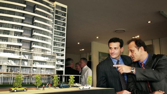 Kim and David Pradella with a model of Pinnacle, one of The Parklands buildings.