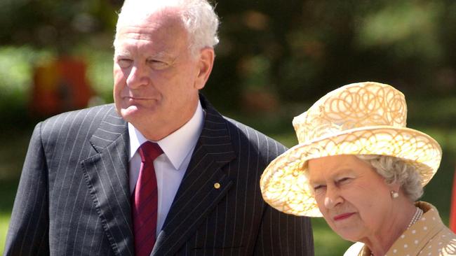 Queen Elizabeth walks alongside then Australian governor-general Peter Hollingworth in Adelaide in 2002. Picture: PA