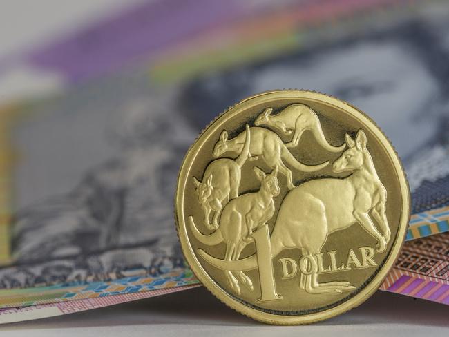 Australian $1 coin and notes close-up, investing, generic