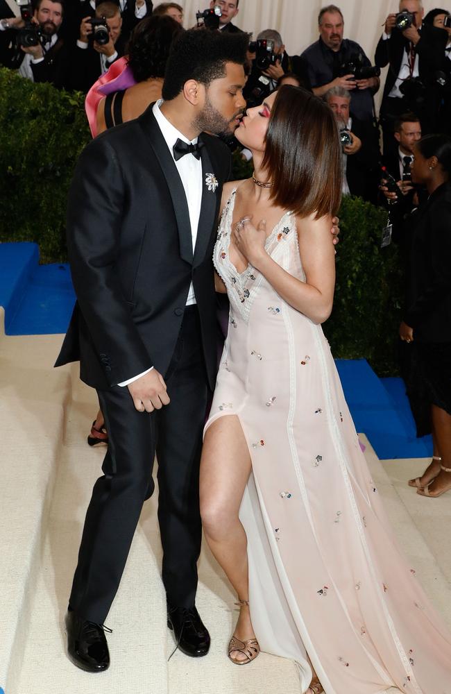 The Weeknd kisses Selena Gomez at “Rei Kawakubo/Commes Des Garcons: Art of the In-Between”, the 2017 Costume Institute Benefit at Metropolitan Museum of Art on May 1, 2017 in New York City. Picture: Getty