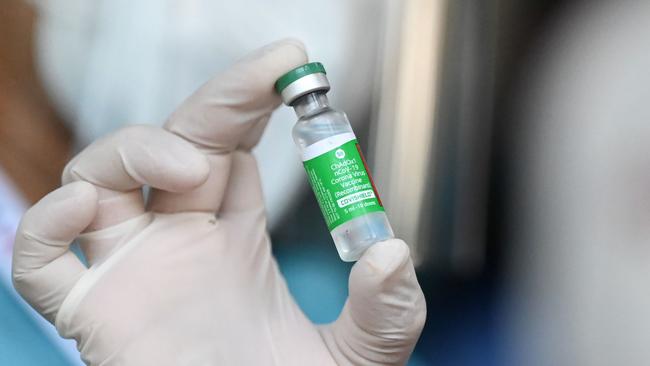 A health worker holds up a vial of Covishield, AstraZeneca-Oxford's COVID-19 coronavirus vaccine. Picture: Ye Aung Thu/AFP