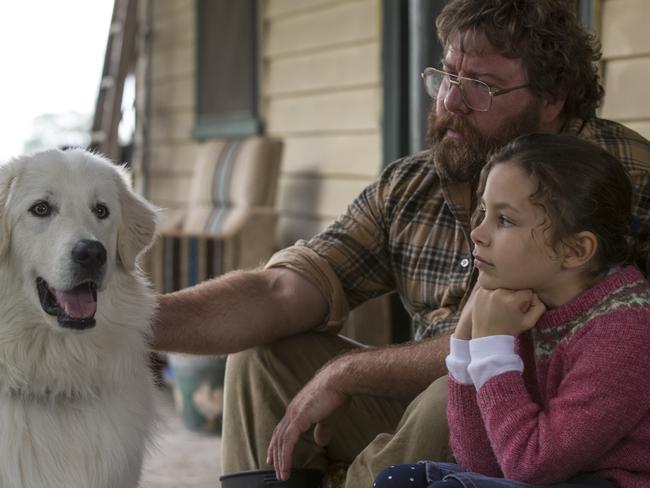 Penguin warrior: Oddball the maremma dog with Shane Jacobson and Coco Jack Gillies.