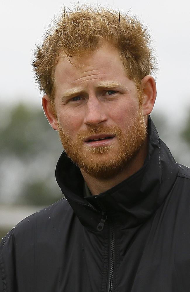 Britain’s Prince Harry walks at Goodwood Aerodrome in Goodwood, southern England, ahead of a flypast by Spitfire and Hurricane aircraft to commemorate the 75th anniversary of the Battle of Britain, a battle fought predominantly in the air, during World War II. Picture: AFP