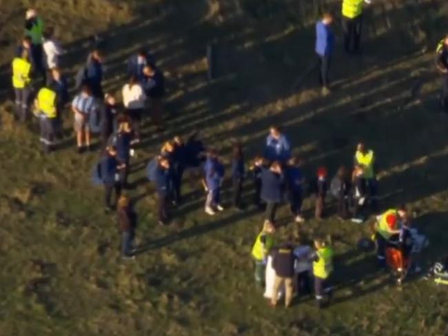 Emergency crews help students at the scene. Picture: 7News