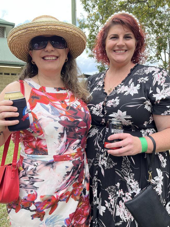 Debbie Cunningham and Robyn Hunter having a ball at Torbanlea Picnic Races.