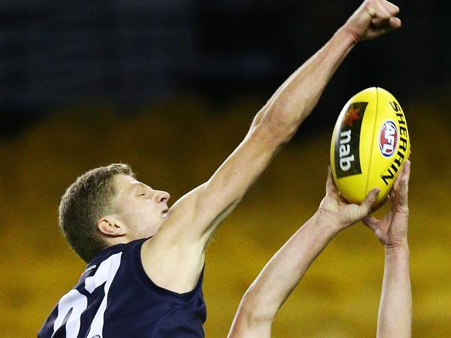 MELBOURNE, AUSTRALIA - JULY 04: Kai Pudney of South Australia marks the ball against Will Kelly of Vic Metro during the U18 AFL Championship match between Vic Metro and South Australia at Etihad Stadium on July 4, 2018 in Melbourne, Australia.  (Photo by Michael Dodge/Getty Images)