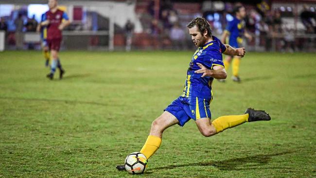MOTION: The Waves' Matt Twyford kicks the ball forward against Brothers Aston Villa on Saturday in the Wide Bay Premier League. Picture: Brian Cassidy
