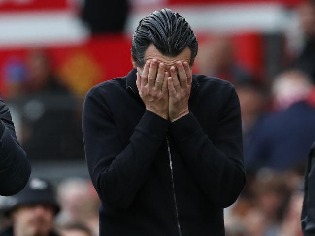 TOPSHOT - Aston Villa's Spanish head coach Unai Emery reacts as he leaves after the English Premier League football match between Manchester United and Aston Villa at Old Trafford in Manchester, north west England, on May 25, 2025. United won the game 2-0. (Photo by Darren Staples / AFP) / RESTRICTED TO EDITORIAL USE. No use with unauthorized audio, video, data, fixture lists, club/league logos or 'live' services. Online in-match use limited to 120 images. An additional 40 images may be used in extra time. No video emulation. Social media in-match use limited to 120 images. An additional 40 images may be used in extra time. No use in betting publications, games or single club/league/player publications. /