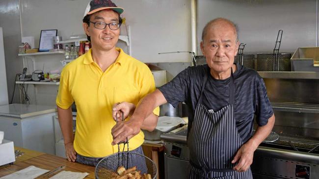 Andrew Wong with father Kent Wong of Busy Bee Fish Bar on Targo St. Picture: Katie Hall