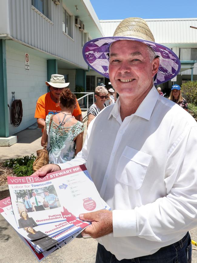 Scott Stewart hands out how to vote cards at Mount Louisa House of Praise for the QLD State Election 2017. Photo: Michael Chambers