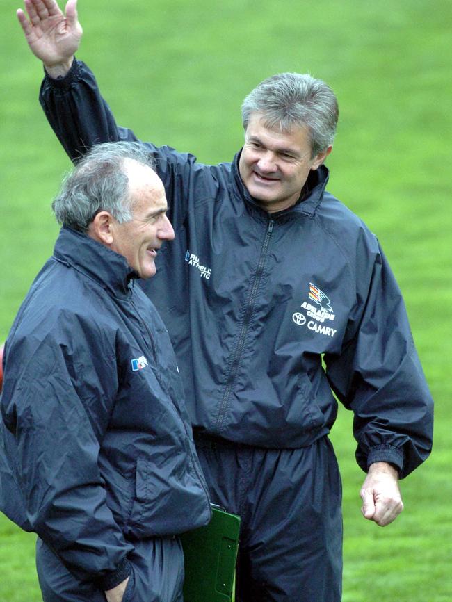 Former cycling coach Charlie Walsh with former Adelaide Crows coach Neil Craig at Football Park in 2004.