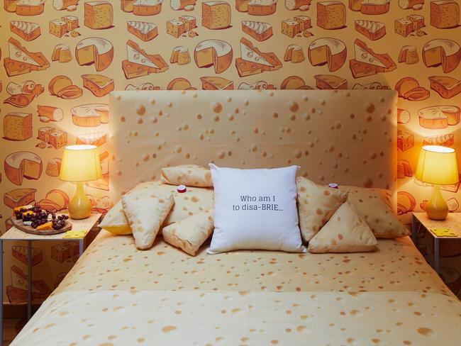 A cheese-themed hotel suite billed as a world-first has opened in London - and it looks un-brie-lievable.      Situated in Camden, fromage fanatics will be able to feast their eyes on cheese-themed wallpaper, throws and cushions as well as take selfies for the â€˜gram of giant cheese installations, before turning in for the night snuggled up in cheese-themed bedding in this ultimate home-from-home homage to fromage.  As the accommodation is self-catered, there are plenty of cheese themed cookbooks to provide inspiration and classic cheese board games to help pass the time - as well as information available on the best cheese getaways and day trips to go on.  And if they fancy a night in without having to cook, guests can even shower with cheese scented soap in the Suite while dialling the cheese hotline delivery service for melted cheesy goodness straight from CafÃ© Rouge delivered to their door... all to be consumed while listening to songs from the specially-compiled cheesy playlist, of course.   The unique concept has been commissioned by French bistro restaurant CafÃ© Rouge to celebrate its new extra cheesy menu, after reports reveal that 700,000 tonnes of cheese is consumed each year, with each cheese loving Brit gobbling up 27.4 grams of the good stuff every single day.   Of this figure, 20,000 diners at CafÃ© Rouge have treated themselves to cheese afternoon tea, and the number of Beef Bourguignon Burgers sold in one year put in a row would be enough to line the Champs Elysee ten times over.  Jacqueline Fletcher, head of marketing at CafÃ© Rouge commented: â€œWe always want to cater to the appetite of our customers, and we know that thereâ€™s a real hunger for cheese-based dishes after serving over 20,000 Cheese Afternoon Teas since launching in 2018.  â€œSo, we wanted to give the nation somewhere new and exciting to be totally immersed in one of their favourite foods in none other than a cheese themed hotel, while also trying some of our winter dishes from