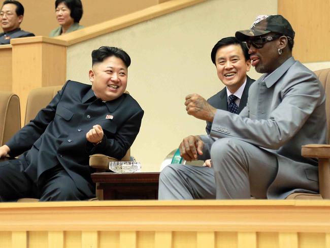 Dennis Rodman (right) watches a basketball game with North Korean leader Kim Jong-un (left) in Pyongyang in 2014. Picture: Korean Central News Agency/Korea News Service via AP