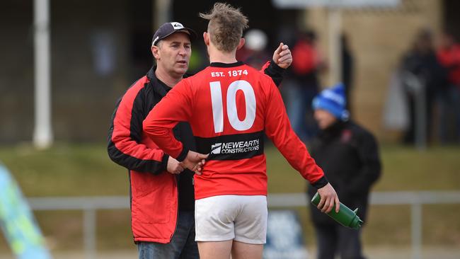 Corey O'Sullivan has a quick work with one of his players.