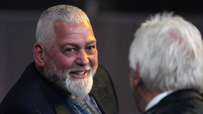 Melbourne identity Mick Gatto chats to a friend in the boxing crowd. Picture: Michael Dodge/AAP.