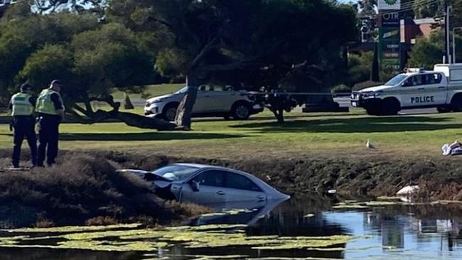 Police at the scene of a serious single-vehicle accident at Kingston S.E. The car left the road at the intersection of Princess Highway and Southern Ports Highway, crashing into Maria Creek. Picture: Harvey Biggs/ Nine News Adelaide