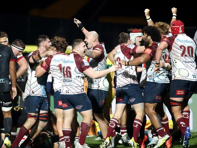 The Reds celebrate their unlikely victory. Picture: Andy Jackson/Getty Images