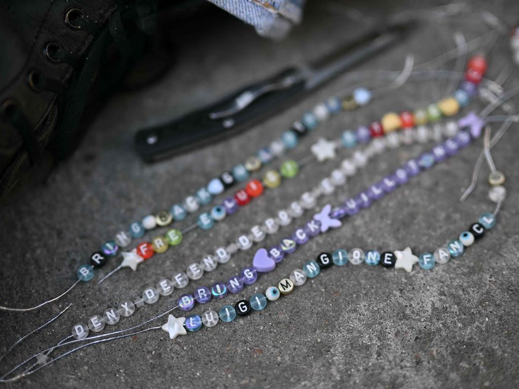 Luigi Mangione fan club bracelets outside the Criminal Court in New York City. Picture: Angela Weiss / AFP