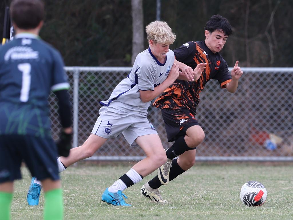 Premier Invitational Football 2024 tournament at Glennon Park Nerang. Field 2...Magic Utd (grey) V Football NT Utd. Picture Glenn Hampson