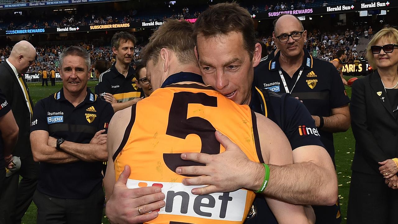 Sam Mitchell and Alastair Clarkson share a moment after winning the 2015 premiership. Picture: AAP Images