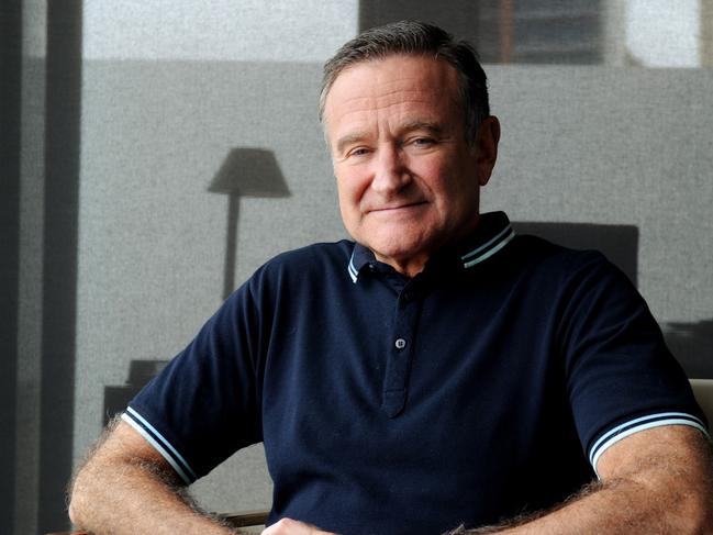 **FILE** A Monday, Dec. 5, 2011 image of American actor and comedian Robin Williams posing for photographs in Sydney. Oscar-winner and comedian Robin Williams has been found dead at his home in California, Monday, Aug. 11, 2014. He was 63. (AAP Image/Tracey Nearmy) NO ARCHIVING