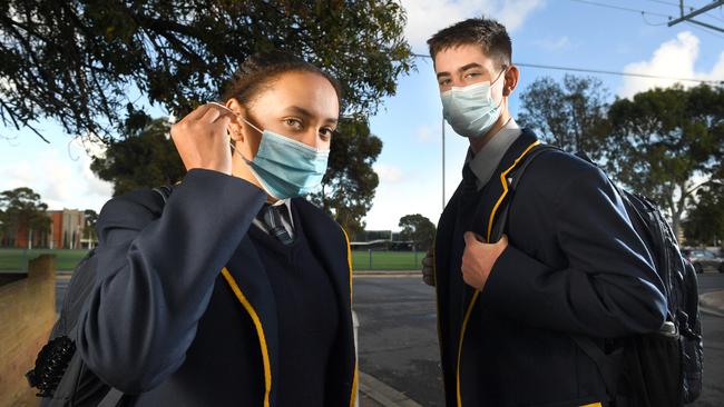 Students Jorja and Mackenzie on the way to school in Adelaide during the pandemic. Picture: Tricia Watkinson