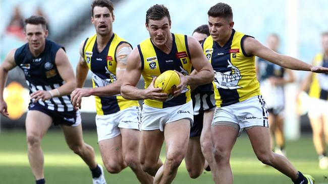 Luke Tapscott gathers the ball for the MPNFL against Geelong FNL at the MCG on Saturday. Picture: Mark Dadswell