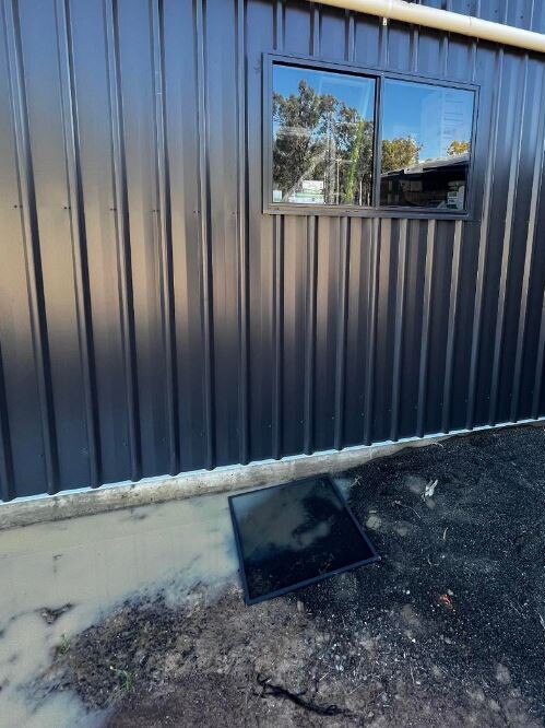 Owner Elliott Mangan said the thieves pulled new fly screens from the windows and seriously damaged the new roller door.