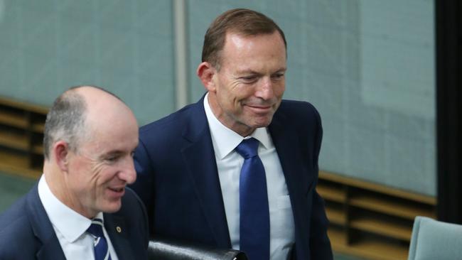 Former Prime Minister Tony Abbott with Stuart Robert depart Question Time in the House of Representatives at Parliament House, Canberra. Picture Gary Ramage