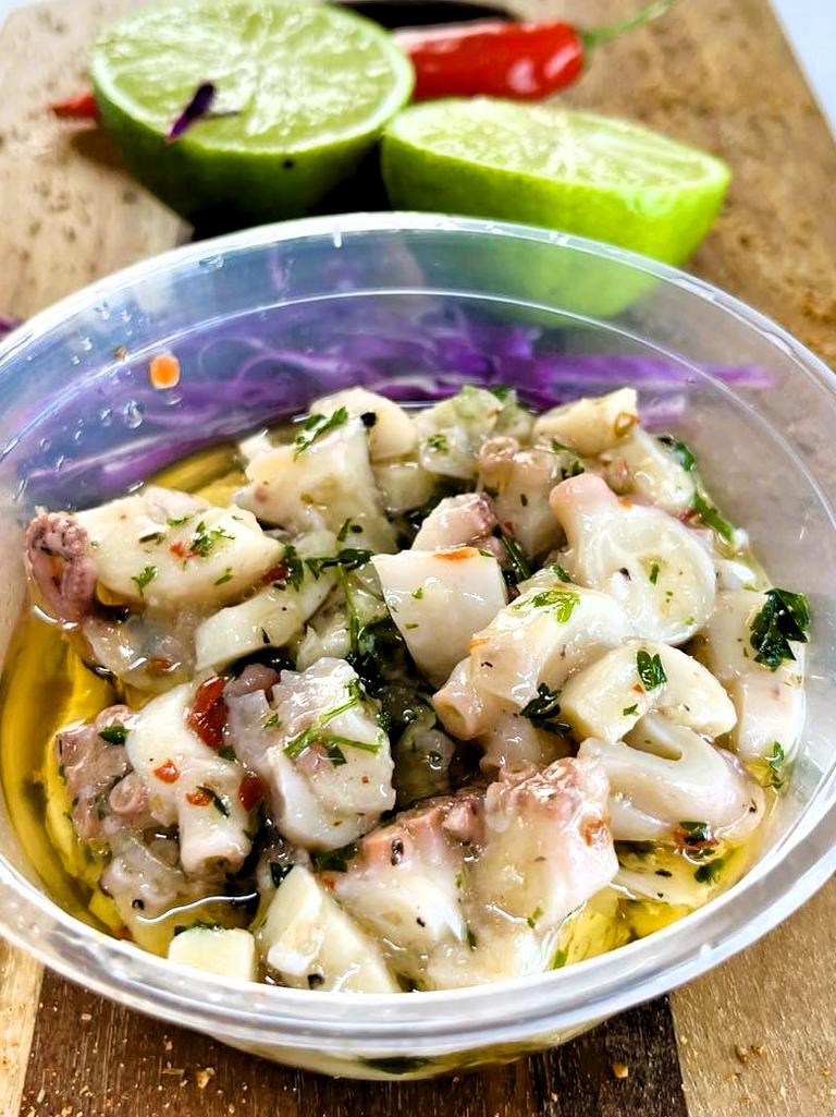 Dom’s Marinated Octopus, a 10-year-old secret recipe known only to Mr Zaghini of Wild Local seafood supplier, gourmet fish-and-chip restaurant and more recently a café and gourmet deli. Owners Bec and Dom Zaghini say the famous dish, the recipe for which is only known by Dom includes local octopus, herbs, onion and garlic. Picture: Cameron Bates
