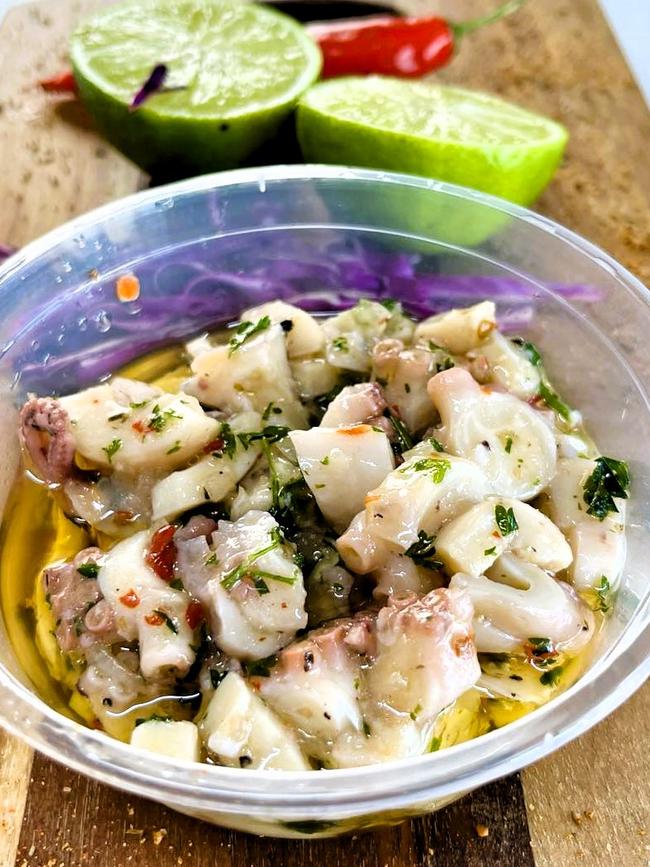 Dom’s Marinated Octopus, a 10-year-old secret recipe known only to Mr Zaghini of Wild Local seafood supplier, gourmet fish-and-chip restaurant and more recently a café and gourmet deli. Owners Bec and Dom Zaghini say the famous dish, the recipe for which is only known by Dom includes local octopus, herbs, onion and garlic. Picture: Cameron Bates