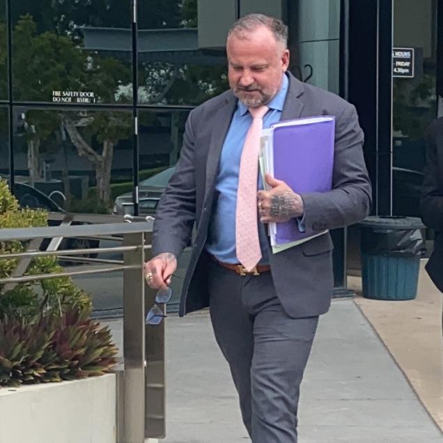 Campbell MacCallum leaves Southport Courthouse the day after being charged with money laundering and fraud.