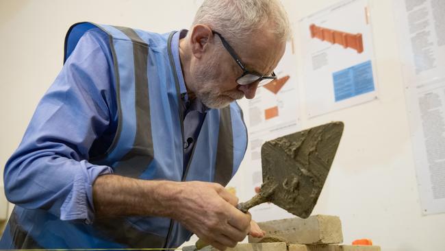 Labour leader Jeremy Corbyn lays a brick during a visit to West Nottinghamshire College Construction Centre in Nottingham. Picture: Getty Images