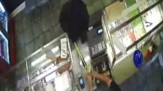 An armed robber stormed the Curry Kebab shop at East Maitland. Supplied screenshot CCTV