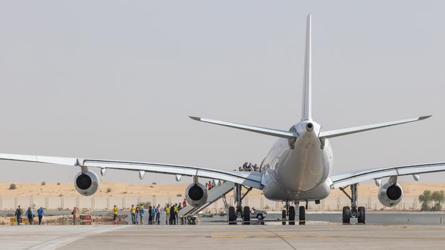 Afghanistan evacuees board a flight to Australia from the Australian Defence Force's main operating base in the Middle East region. Picture: ADF