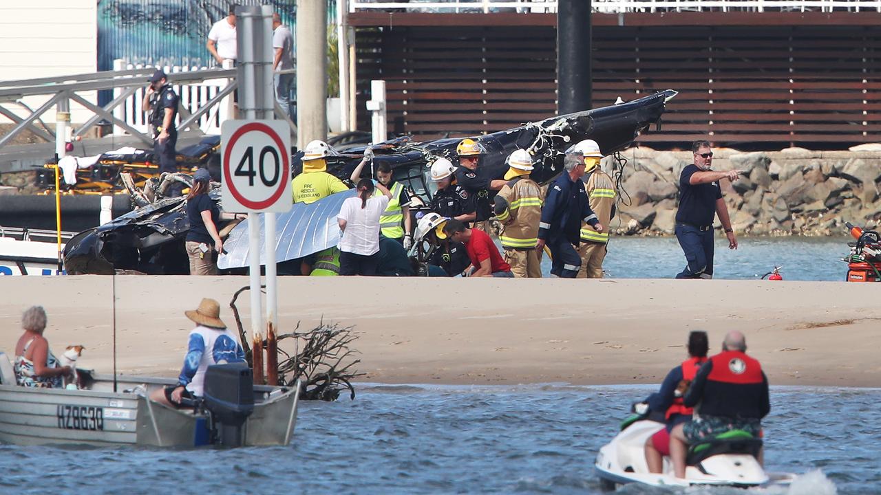 The chaotic scene as bystanders and emergency services respond to the Sea World helicopter crash. Picture: Glenn Hampson