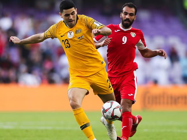 AL AIN, UNITED ARAB EMIRATES - JANUARY 06: Tom Rogic of Australia is challenged by Baha' Faisal of Jordan during the AFC Asian Cup Group B match between Australia and Jordan at Hazza Bin Zayed Stadium on January 06, 2019 in Al Ain, United Arab Emirates. (Photo by Francois Nel/Getty Images)
