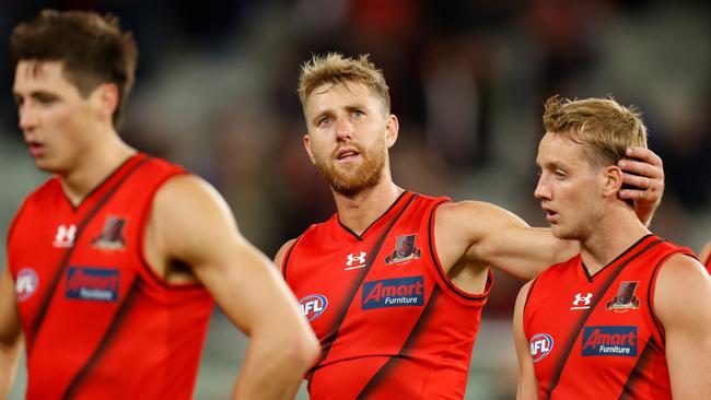 Dyson Heppell (left) and Darcy Parish of the Bombers look dejected after a loss to Melbourne at the MCG. Picture: Michael Willson/AFL Photos via Getty Images